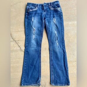 Ariya Jean Size 11/12 missing the button on back left pocket